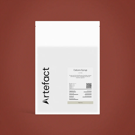White syrup package with 'Artefact' branding on a brown background