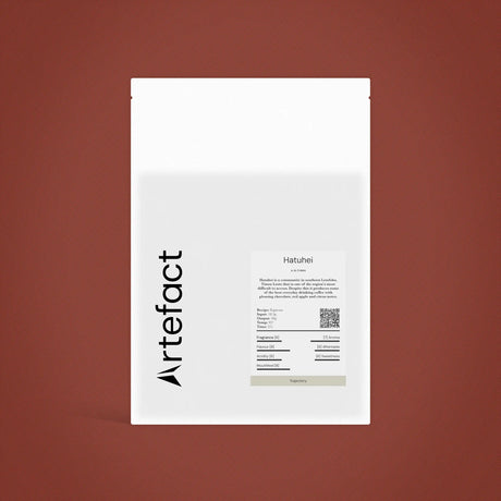 White product packaging with 'Artefact' branding on a brown background